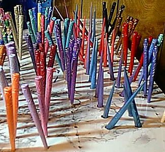 Freshly painted sticks drying on the beading table